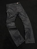 「CURVED BLADE」 Creased Waxed Spiral Curved-Leg Jeans