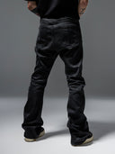 「CURVED BLADE」 Creased Waxed Spiral Curved-Leg Jeans