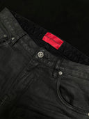「CURVED BLADE」 Creased Waxed Spiral Curved-Leg Jeans